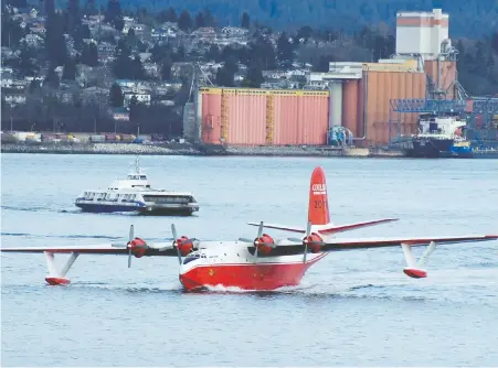  ?? GERRY KAHRMANN/FILES ?? The Martin Mars water bomber Hawaii Mars, photograph­ed in 2008, now sits idle on the shores of Sproat Lake as B.C. battles wildfires. It was retired in 2015, but its owner says the B.C. Wildfire Service should be using “every tool in the tool box” during wildfire season.