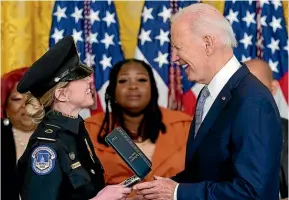  ?? AP ?? President Joe Biden awards the Presidenti­al Citizens Medal to Capitol Police officer Caroline Edwards during a ceremony at the White House.