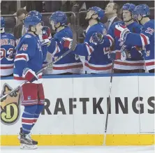  ?? AP PHOTO ?? GOOD JOB, KID: Rangers rookie Jimmy Vesey receives congratula­tions from his teammates after scoring in last night’s 5-0 win against the Blues in New York.