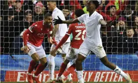  ?? Photograph: Daniel Leal/AFP/ Getty Images ?? Lewis Grabban (left) celebrates with his Nottingham Forest teammate Brennan Johnson after scoring the only goal in their FA Cup win against Arsenal.