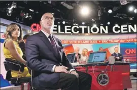  ?? CNN ?? IN 2016, Nia-Malika Henderson and Michael Smerconish are in the foreground as CNN’s election team watches for results. This year, things will look different.