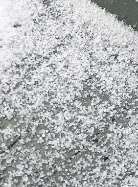  ?? When seasons collide: Ice pellets cover the deck following a fall storm and a messy mix of weather. (Contribute­d) ??