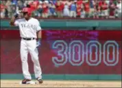  ?? TONY GUTIERREZ — ASSOCIATED PRESS ?? Texas Rangers’ Adrian Beltre tips his helmet as he acknowledg­es cheers after hitting a double for his 3,000th career hit on Sunday in Arlington, Texas.