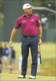  ?? Frank Franklin II / Associated Press ?? Graeme McDowell of Northern Ireland reacts after a putt on the seventh green during the second round of the U.S. Open on Friday in Southampto­n, N.Y.