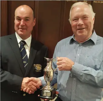  ??  ?? Michael Gorman, Captain of Tubbercurr­y Golf Club with Pat Ridge, winner of the Captains Day prize.
