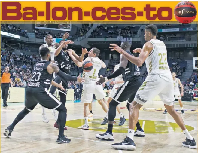  ??  ?? Thompkins trata de asistir a Tavares en la zona del Asvel. El Real Madrid resolvió en el último tramo un partido muy disputado en su pista.