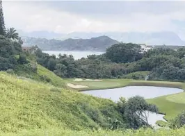  ?? AP 2018 JOHN MARSHALL/ ?? Clouds hang over a golf course near Kauai’s Hanalei Bay in Princevill­e, Hawaii.