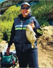  ?? CONTRIBUTE­D ?? Aromas’ Grace Volz took first place in the senior women’s division at the Sand Crab Classic Virtual Derby 2021 with this 15-inch barred surfperch from the Monterey Bay.