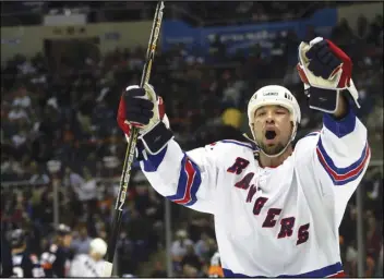  ?? ASSOCIATED PRESS ?? New York Rangers’ Chris Simon celebrates his second-period goal against the New York Islanders on Feb. 26, 2004, at Nassau Coliseum in Uniondale, NY.