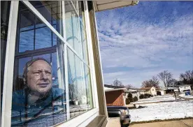  ?? ZBIGNIEW BZDAK/CHICAGO TRIBUNE ?? Ken Zurek, 63, sits in his home in Highland, Ind. on Feb. 11. Zurek and his wife arrived in China days before news broke of the coronaviru­s. They cut their trip short because of the virus and decided to self quarantine themselves in their Highland home for 15 days, just as an extra precaution.