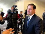  ?? PHOTO BY BLAKE HERZOG/YUMA SUN ?? GOV. DOUG DUCEY SPEAKS TO REPORTERS after delivering a version of his State of the State address at Yuma’s Pivot Point Conference Center Thursday.