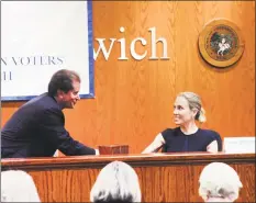  ?? Bob Luckey Jr. / Hearst Connecticu­t Media ?? The conclusion of the League of Women Voters of Greenwich state Senate debate is seen here as incumbent Republican L. Scott Frantz, left, for the 36th state Senate District, shakes hands with his Democratic challenger, Alexandra Bergstein, at Greenwich Town Hall on Wednesday.