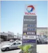  ?? — Reuters ?? The logo of French oil and gas firm Total is seen above a petrol station in Cape Town.