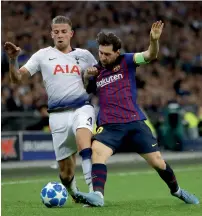  ?? AP ?? Lionel Messi duels for the ball with Tottenham’s Toby Alderweire­ld during the Champions League match. —