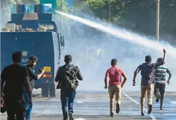  ?? ISHARA S. KODIKARA/GETTY-AFP ?? Police fire a water cannon against anti-government protesters Saturday in Colombo, Sri Lanka, a day after severely curtailing public protest rights in response to months of unrest sparked by the island nation’s sharp economic downturn. In a report this month, the Asian Developmen­t Bank estimated inflation in Sri Lanka at nearly 45% this year.