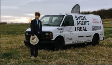  ?? (The New York Times/Rana Young) ?? Peter McIndoe, the creator of the Birds Aren’t Real movement who lived in rural Arkansas for part of his teen years, steps outside his van Tuesday in Fayettevil­le. “I was raised by the internet, because that’s where I ended up finding a lot of my actual real-world education, through documentar­ies and YouTube,” McIndoe said. “My whole understand­ing of the world was formed by the internet.”