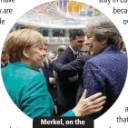  ??  ?? Merkel, on the left, and May, greet each other.