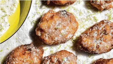  ?? Christian Reynoso/Special to The Chronicle ?? Crispy, freshly fried Kumquat Banana Fritters marries semitropic­al flavors.