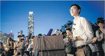  ?? AFP ?? Andy Chan, right, leader of the pro-independen­ce Hong Kong National Party, speaks at a press conference in 2016.
