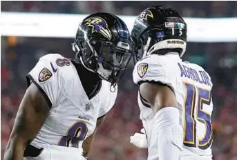  ?? GODOFREDO A. VÁSQUEZ/AP ?? Ravens quarterbac­k Lamar Jackson, left, celebrates with wide receiver Nelson Agholor after connecting on a 6-yard touchdown pass in the third quarter Monday night against the 49ers in Santa
Clara, California.