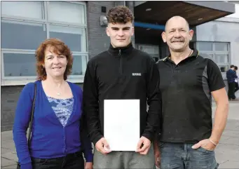  ??  ?? Brendan Cunningham with his parents Miriam and Ritchie Cunningham at Summerhill College.