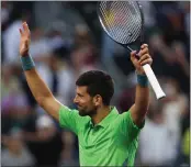  ?? CLIVE BRUNSKILL — GETTY IMAGES ?? Novak Djokovic acknowledg­es a cheering crowd after his second-round win over Aleksandar Vukic at Indian Wells.