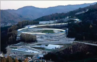  ?? Ahn Young-joon / The Associated Press ?? South Korea’s sleepy skiing destinatio­n of Pyeongchan­g — including the Alpensia Sliding Center — is finally looking like a Winter Olympics host city after more than a decade of work, two failed bids, and chapters of controvers­y.
