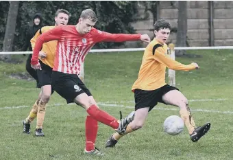  ??  ?? Silksworth CW (red/white) fire in a shot against Annfield Plain on Saturday. Picture by Kevin Brady