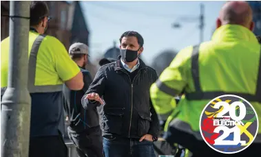  ??  ?? Anas Sarwar talks to Chris Mitchell, cleansing convener of GMB Scotland