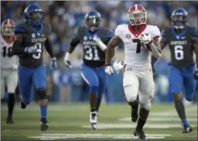  ?? BRYAN WOOLSTON - THE ASSOCIATED PRESS ?? FILE - In this Saturday, Nov. 3, 2018, file photo, Georgia running back D’Andre Swift (7) runs for a touchdown during the second half an NCAA college football game against Kentucky in Lexington, Ky.