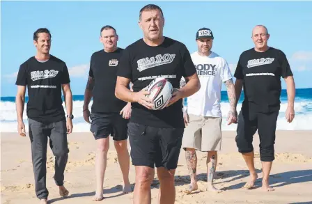  ?? Picture: CRAIG WILSON ?? Former Penrith player Darren Brown (centre) and his footy mates (from left) Adam Moore, Jason Webb, Ben Higgs and Dave McElhinney get ready for their walk from the Gold Coast to Sydney to raise awareness for suicide prevention.