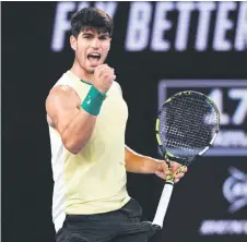  ?? — AFP photo ?? Alcaraz reacts after a point against Zverev during their men’s singles quarterfin­al match on day 11 of the Australian Open tennis tournament in Melbourne.