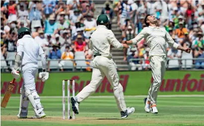  ?? AP ?? South Africa’s Duanne Olivier celebrates the wicket of Pakistan’s Azar Ali on day one of the second Test at Newlans on Thursday. —
