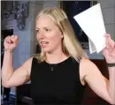  ?? Canadian Press photo ?? Environmen­t Minister Catherine McKenna raises her arms to cheer for the Ottawa Senators hockey team, before she started a news conference in Ottawa on Thursday.