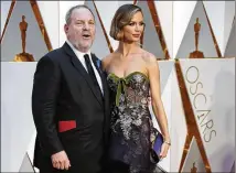  ?? JAY L. CLENDENIN / LOS ANGELES TIMES ?? Harvey Weinstein and Georgina Chapman at the 2017 Academy Awards. Multiple sexual misconduct allegation­s against him have crippled the company.