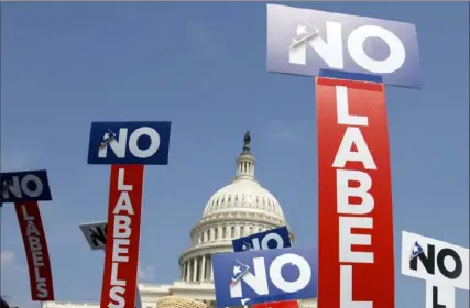  ?? Jacquelyn Martin/Associated Press ?? People with the group No Labels hold signs during a rally in 2011 on Capitol Hill in Washington. The new political party has already secured ballot access in Arizona and 10 other states. Its organizers say they are on track to reach 20 states by the end of this year and all 50 states by Election Day.