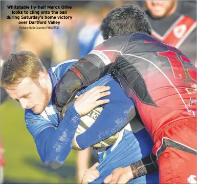  ?? Picture: Ruth Cuerden FM4651532 ?? Whitstable fly-half Marck Olive looks to cling onto the ball during Saturday’s home victory over Dartford Valley