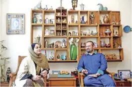  ??  ?? Narges Abyar, left, sits with her husband Mohammad Hossein Ghasemi, who is her film producer, during an interview.