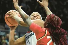  ?? CLOE POISSON/SPECIAL TO THE COURANT ?? Uconn’s KK Arnold puts up a shot over Maryland guard Bri Mcdaniel on Thursday in Storrs.