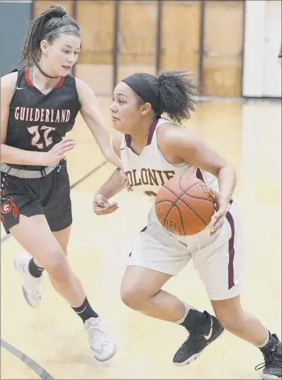  ?? Jenn March / Special to the Times Union ?? Colonie’s Aliyah Wright dribbles past Guilderlan­d’s Graycen Dubin on Thursday. Wright had 19 points.