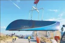  ??  ?? A prototype Hyperloop One pod is prepared for testing.