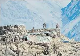  ??  ?? Indian and Chinese troops and tanks disengage from the banks of Pangong lake in eastern Ladakh on February 16, 2021