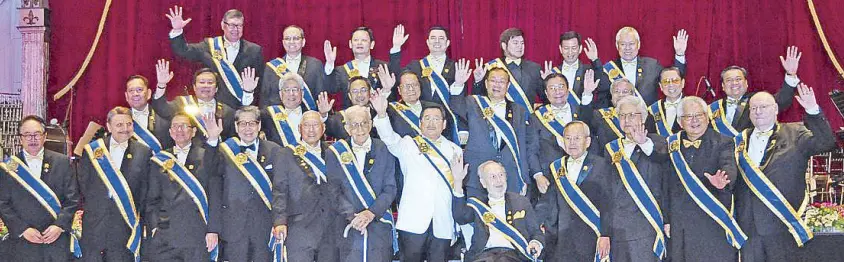  ??  ?? Rotary Club of Makati president Eddie Yap (center, front row) and 28 past presidents celebrate half a century of community service that included the first postal office in Makati, 15,442,217 books to public schools, Rotary’s global anti-polio...