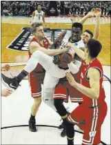  ?? BILL WIPPERT/THE ASSOCIATED PRESS ?? Villanova forward Darryl Reynolds grabs a rebound against Wisconsin during the Wildcats’ NCAA Tournament second-round game Saturday in Buffalo, N.Y. The loss by Villanova, the top seed overall, cost one bettor $50,000.