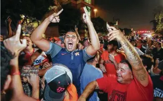  ?? Godofredo A. Vasquez / Houston Chronicle ?? Houston fans celebrate after the Astros defeated the Los Angeles Dodgers in the World Series.