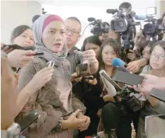  ?? — Reuters ?? A family member speaks to the media after an MH370 briefing closed door meeting in Putrajaya.