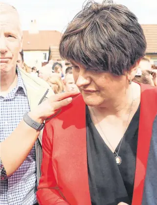  ?? PHOTO: BRIAN LAWLESS/PA WIRE ?? United in sorrow: Sinn Féin leader Mary Lou McDonald with DUP leader Arlene Foster at a vigil in Derry following the death of journalist Lyra McKee.