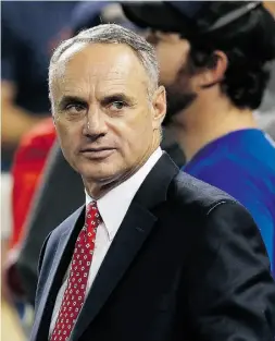  ?? Vaughn Ridley / Gety Images ?? Commission­er of Major League Baseball Rob Manfred took in Friday’s game between the Blue Jays and Rangers and field questions about the future of baseball in Montreal.