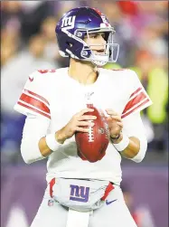  ?? Maddie Meyer / Getty Images ?? The Giants’ Daniel Jones looks to throw a pass against the New England Patriots during the second quarter.