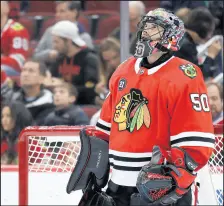  ?? NAM Y. HUH/AP ?? Chicago Blackhawks goalie Corey Crawfordst­ill needs medical clearance to play, stemming from a concussion he suffered on Dec. 16.